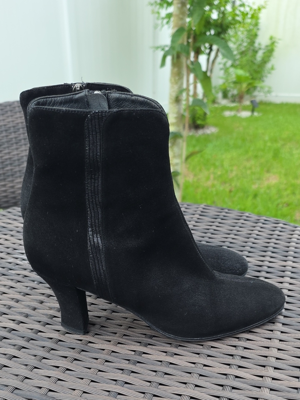 Thierry Rabotin ankle boots feature a black suede upper with a stylish textured